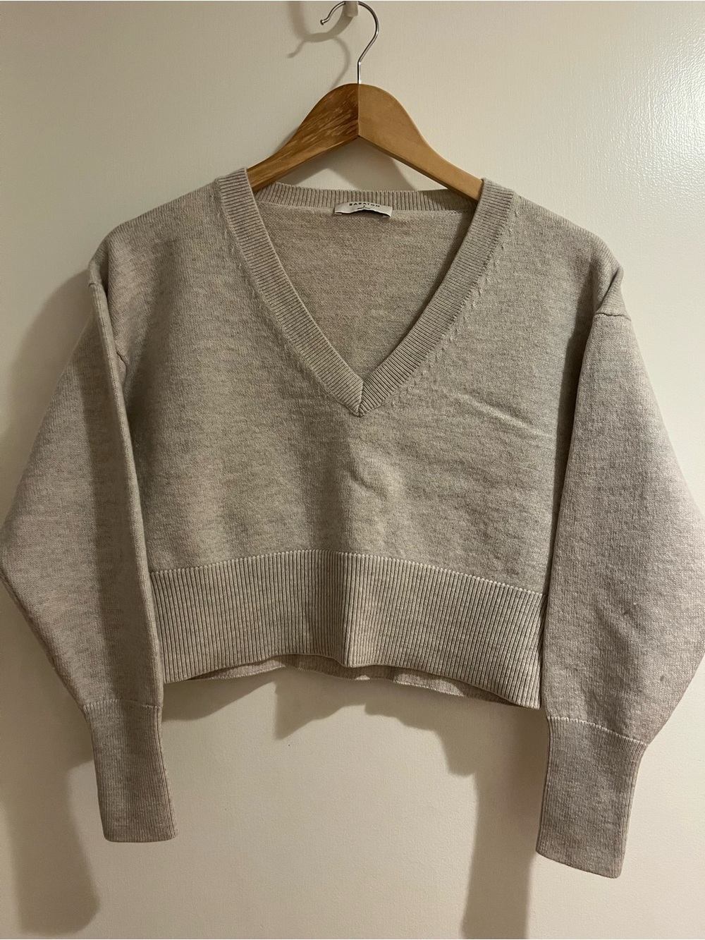 Babaton Cropped V-Neck Sweater in Light Beige